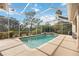Relaxing screened pool and spa with a view of the backyard at 22435 Panther Loop, Bradenton, FL 34202