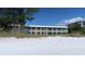 Exterior view of beachfront property on the Gulf of Mexico with a sugar sand beach at 2310 Gulf N Dr # 205, Bradenton Beach, FL 34217