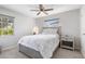 Charming bedroom with a queen bed and window at 2320 Cass St, Sarasota, FL 34231