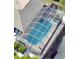 Aerial view of the screened-in pool area, surrounded by lush landscaping at 2426 Nassau St, Sarasota, FL 34231
