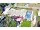 Home aerial shot of large screened pool, outdoor patio and lush landscaping at 2426 Nassau St, Sarasota, FL 34231