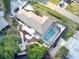 This beautiful home features a screened pool, lush landscaping, and ample parking in a desirable location at 2426 Nassau St, Sarasota, FL 34231