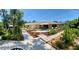 Beautifully landscaped backyard with patio, walkways, and lush tropical foliage, perfect for outdoor enjoyment at 2426 Nassau St, Sarasota, FL 34231