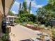 Expansive backyard patio area with seating, manicured garden, and lush landscaping at 2426 Nassau St, Sarasota, FL 34231