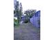 Backyard lot showing the privacy fence and view of the neighbor's pool at 2426 Nassau St, Sarasota, FL 34231
