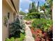 Lush tropical landscaping and garden surrounding the home's exterior at 2426 Nassau St, Sarasota, FL 34231