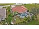 Aerial view of a house with a pool and neighborhood at 25324 Alicante Dr, Punta Gorda, FL 33955