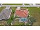 Aerial view of a house with solar panels and a pool at 25324 Alicante Dr, Punta Gorda, FL 33955