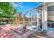 Screened pool area with brick patio and lush landscaping at 25324 Alicante Dr, Punta Gorda, FL 33955