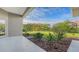View of the private backyard showcasing lush landscaping and mature trees on a sunny day at 2886 Grazeland Dr, Sarasota, FL 34240