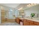Elegant bathroom with double vanity, soaking tub, and a separate shower at 2886 Grazeland Dr, Sarasota, FL 34240