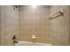 Simple bathroom with shower/tub combo and neutral tile at 2886 Grazeland Dr, Sarasota, FL 34240