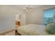 Bright bedroom with a queen-size bed, en-suite bathroom access, and natural light at 2886 Grazeland Dr, Sarasota, FL 34240