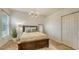 Spacious bedroom with a large bed, ample closet space, and a ceiling light at 2886 Grazeland Dr, Sarasota, FL 34240