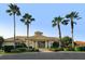 Community clubhouse with palm trees and ample parking at 2886 Grazeland Dr, Sarasota, FL 34240