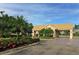Gated entrance to a community with lush tropical landscaping at 2886 Grazeland Dr, Sarasota, FL 34240