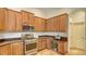 Well-equipped kitchen features ample cabinetry and stainless steel appliances at 2886 Grazeland Dr, Sarasota, FL 34240