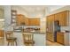 Modern kitchen boasts stainless steel appliances and light wood cabinets at 2886 Grazeland Dr, Sarasota, FL 34240