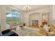 Spacious living room featuring comfortable seating and a large area rug at 2886 Grazeland Dr, Sarasota, FL 34240