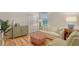 Bright living room features comfy seating, a large window, and stylish decor at 2886 Grazeland Dr, Sarasota, FL 34240