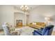 Bright living room with a decorative rug, comfortable seating and a painting with colors at 2886 Grazeland Dr, Sarasota, FL 34240