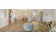 Spacious living room with tile flooring, and access to the back patio at 2886 Grazeland Dr, Sarasota, FL 34240