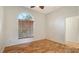 Home office with hardwood floors and large window providing natural light at 2886 Grazeland Dr, Sarasota, FL 34240