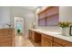 Home office features a built-in desk, cabinet storage, and exterior access at 2886 Grazeland Dr, Sarasota, FL 34240