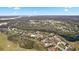 Aerial perspective showcasing a home's serene setting in a golf course community at 2957 Wilderness E Blvd, Parrish, FL 34219