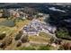 Aerial view of community clubhouse, golf course, and tennis courts at 2957 Wilderness E Blvd, Parrish, FL 34219