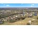 An aerial view showing a house's location within a luxurious golf course community at 2957 Wilderness E Blvd, Parrish, FL 34219