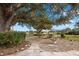 Landscaped backyard with fountain and golf course view at 2957 Wilderness E Blvd, Parrish, FL 34219