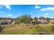 Spacious backyard with lush landscaping and a screened patio at 2957 Wilderness E Blvd, Parrish, FL 34219