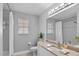 Modern bathroom with granite countertop and tiled shower at 2957 Wilderness E Blvd, Parrish, FL 34219