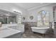 Elegant bathroom with a freestanding tub and walk-in shower at 2957 Wilderness E Blvd, Parrish, FL 34219