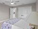Bright bedroom with ceiling fan and double door closet at 2957 Wilderness E Blvd, Parrish, FL 34219
