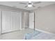 Spacious bedroom with double door closet and ceiling fan at 2957 Wilderness E Blvd, Parrish, FL 34219