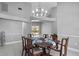 Bright dining room featuring a wood table and chandelier at 2957 Wilderness E Blvd, Parrish, FL 34219