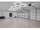 Spacious garage with automatic door and modern lighting at 2957 Wilderness E Blvd, Parrish, FL 34219