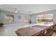 Bright and airy Gathering room with access to a screened patio at 2957 Wilderness E Blvd, Parrish, FL 34219