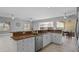 Kitchen with granite island and stainless steel dishwasher at 2957 Wilderness E Blvd, Parrish, FL 34219