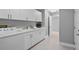 Laundry room with white cabinets and countertop at 2957 Wilderness E Blvd, Parrish, FL 34219