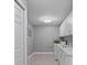 Bright laundry room with washer, dryer and storage at 2957 Wilderness E Blvd, Parrish, FL 34219