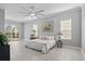Main bedroom with ceiling fan and backyard access at 2957 Wilderness E Blvd, Parrish, FL 34219