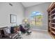 Spacious office features two armchairs, ottoman, and large window at 2957 Wilderness E Blvd, Parrish, FL 34219