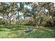 Restful park bench under large oak trees at 2957 Wilderness E Blvd, Parrish, FL 34219