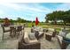 Relaxing patio area with wicker furniture overlooking the golf course at 2957 Wilderness E Blvd, Parrish, FL 34219