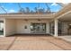 Covered patio with brick pavers and pool view at 2957 Wilderness E Blvd, Parrish, FL 34219