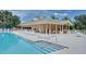 Community pool and recreation area with plenty of seating at 2957 Wilderness E Blvd, Parrish, FL 34219