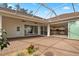 Spacious covered patio with access to kitchen and pool at 2957 Wilderness E Blvd, Parrish, FL 34219